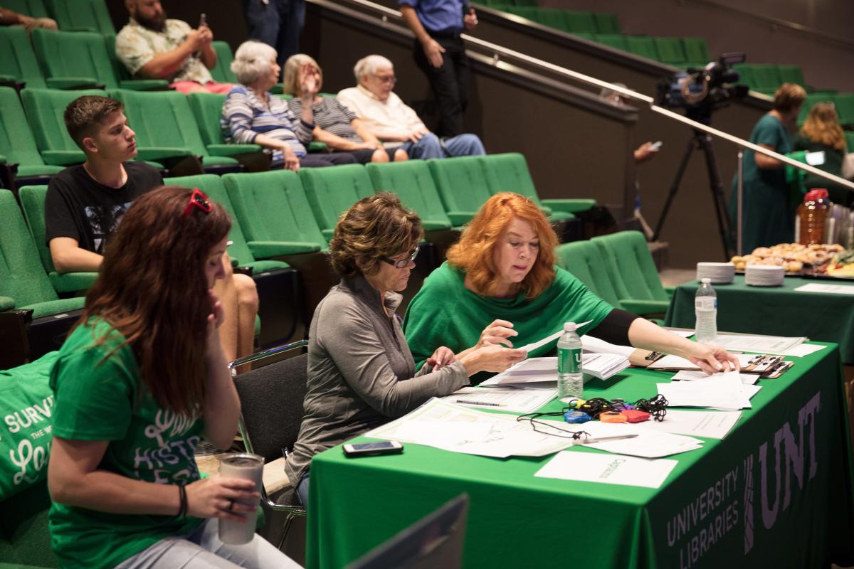 people sitting in seats and at a table