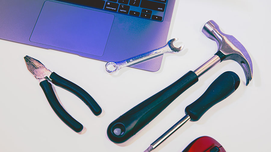 white outline of tools and grid lines on a blue background